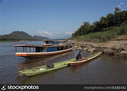 Boats at the shoreline of River Mekong, Luang Prabang, Laos