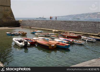 Boats docked at a harbor, Borgo Marinaro, Castel Dell&acute;ovo, Bay of Naples, Naples, Naples Province, Campania, Italy