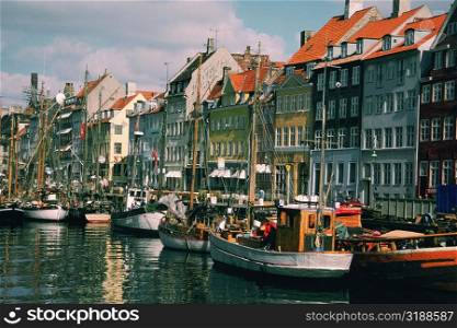 Boats in a canal in front of buildings, Copenhagen, Denmark