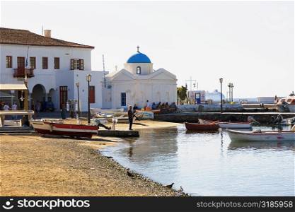 Boats in front of a church, Mykonos, Cyclades Islands, Greece