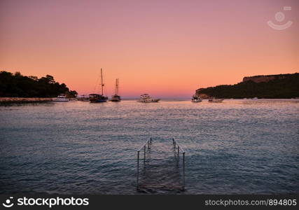 Boats in Kemer Moonlight Bay Antalya at sunset. Kemer Moonlight Beach