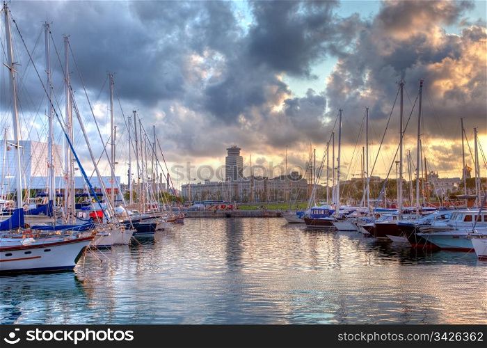 Boats in the harbor of Barcelona, Spain at sunset