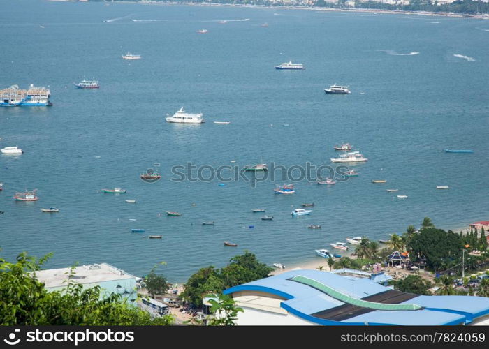 Boats moored along the shore. The city. There are many boats moored for visitors to the islands.