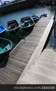 Boats moored to a jetty