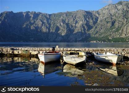 Boats near pier in Kotor bay, Montenegro