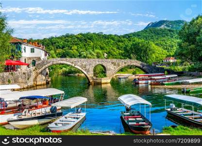Boats near Stari Most on Crnojevica river in Montenegro. Boats near Stari Most