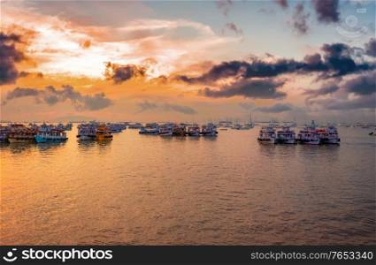 Boats on Mumbai water at dawn. Colaba region of Mumbai, Maharashtra, India.