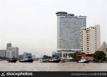 Boats on the Chao Phraya river in Bangkok, Thailand