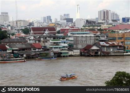 Boats on the Chao Phraya river in Bangkok, Thailand