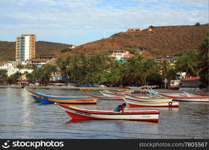 Boats on the water near the beach in Pampatar, Venezuela