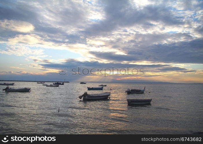 Boats under the setting sun
