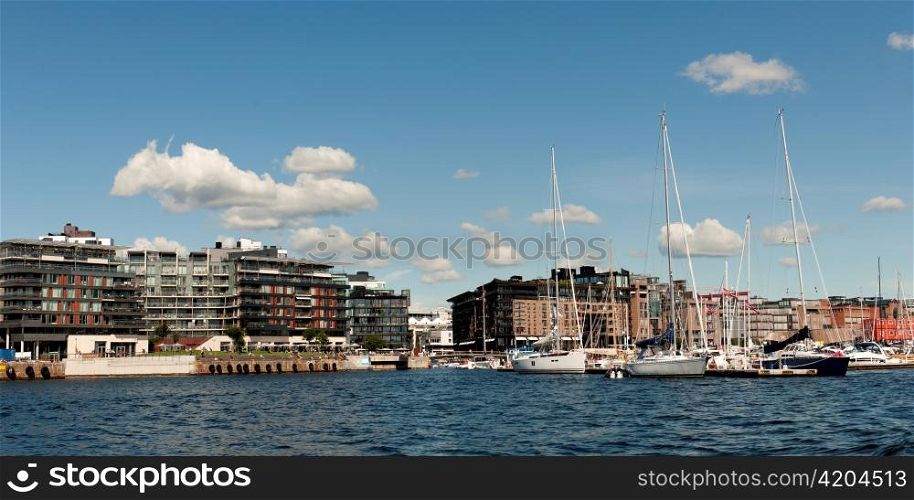 Boats with buildings at Oslo Harbor, Oslofjord, Oslo, Norway