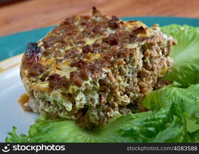 Bobotie also spelt bobotjie, is a South African dish consisting of spiced minced meat baked with an egg-based topping
