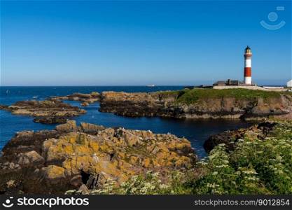 Boddam, United Kingdom - 23 June, 2022: view of the historic Buchan Ness Lighthouse in northern Scotland