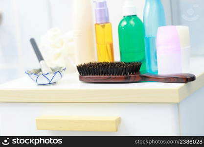 Body and skin care,hygiene concept - bottles with liquid soap or lotion cosmetics set in bathroom. Toiletries in bathroom on shelf