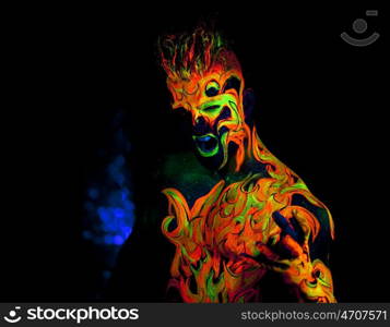 Body art glowing in ultraviolet light