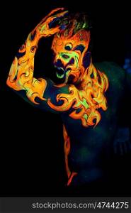 Body art glowing in ultraviolet light