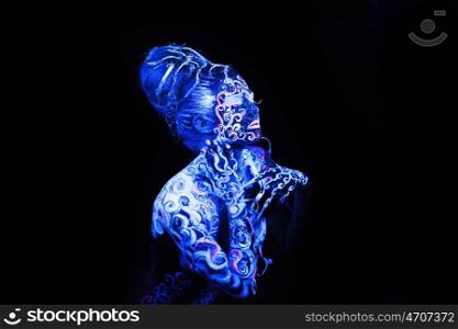 Body art glowing in ultraviolet light, four elements - air