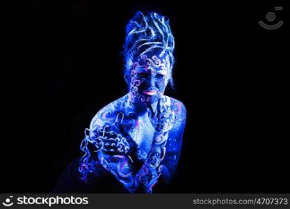 Body art glowing in ultraviolet light, four elements - air