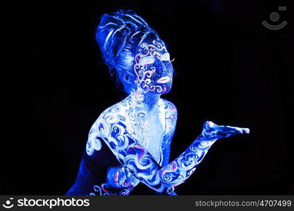 Body art glowing in ultraviolet light, four elements - air