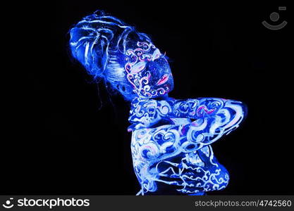 Body art glowing in ultraviolet light, four elements - air