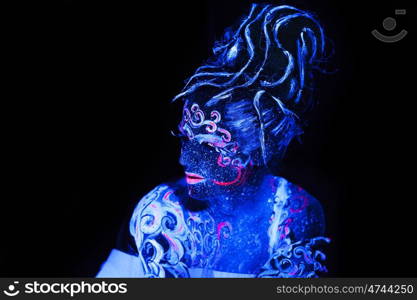 Body art glowing in ultraviolet light, four elements - air