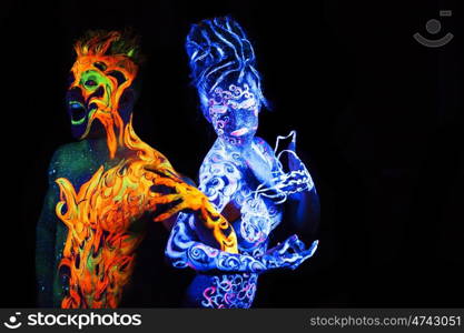 Body art glowing in ultraviolet light, four elements, Air against Fire