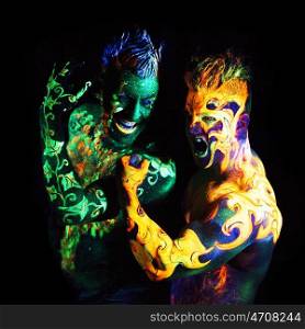 Body art glowing in ultraviolet light, four elements, Earth against Fire