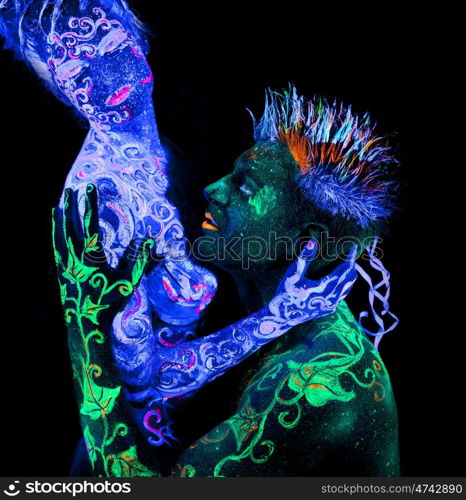 Body art glowing in ultraviolet light, four elements, Land Loves Air