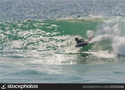 Body boarder riding a big wave