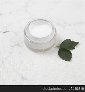 body butter with leaves marble background