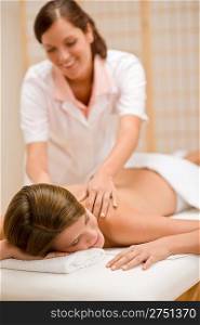 Body care - woman back massage at day spa