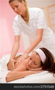 Body care - woman back massage at day spa massage