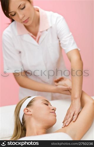 Body care - woman hand massage in day spa