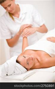 Body care - woman hand massage in day spa salon