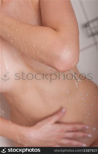 Body care: Woman having shower in the bathroom