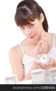 Body care: Young woman with jar of moisturizer in bathroom, on white background