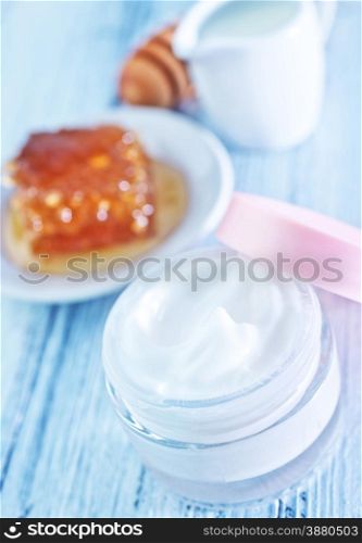 body lotion in glass bank and on a table