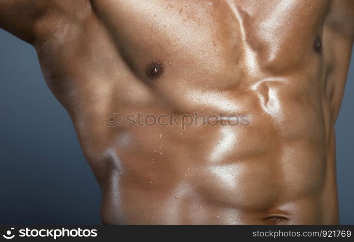 Body of muscular man. Horizontal studio shot