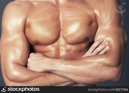 Body of muscular man. Horizontal studio shot