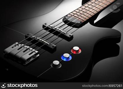 Body of the electric bass guitar. Close up on the body of elegant black bass guitar, black glossy background