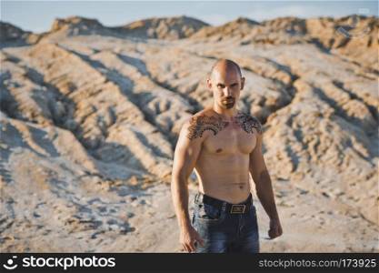 Body of the man with tattoos mehndi.. Naked torso of the brawny man with a tattoo 3417.