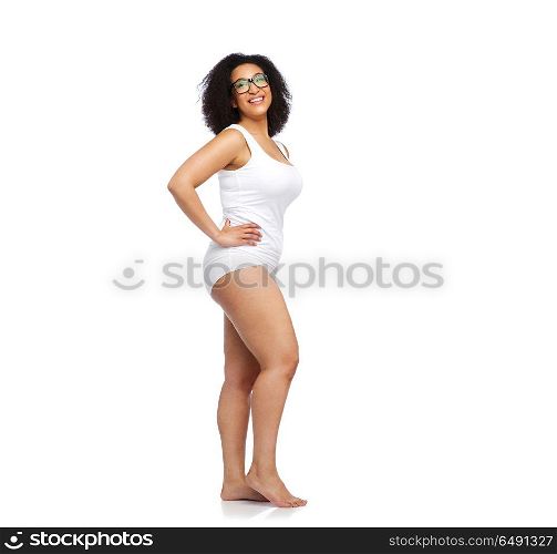 body positive and people concept - happy african american woman in white underwear. happy african american woman in white underwear. happy african american woman in white underwear