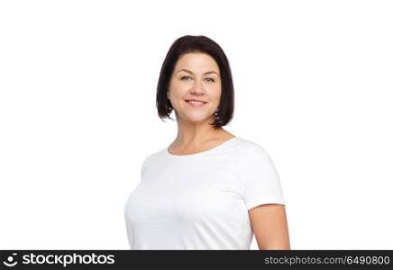 body positive and people concept - happy middle age woman in white t-shirt. happy middle age woman in white t-shirt. happy middle age woman in white t-shirt