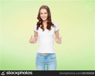 body positive and people concept - happy slim woman in white t-shirt pointing fingers to herself over lime green background. woman in white t-shirt pointing fingers to herself. woman in white t-shirt pointing fingers to herself