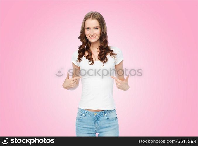 body positive and people concept - happy slim woman in white t-shirt pointing fingers to herself over pink background. woman in white t-shirt pointing fingers to herself. woman in white t-shirt pointing fingers to herself