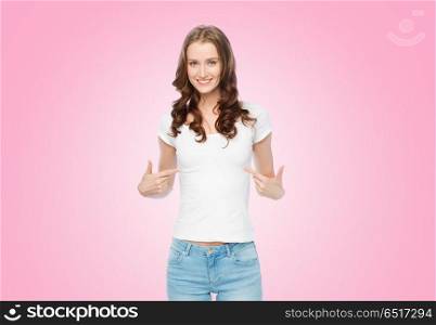body positive and people concept - happy slim woman in white t-shirt pointing fingers to herself over pink background. woman in white t-shirt pointing fingers to herself. woman in white t-shirt pointing fingers to herself