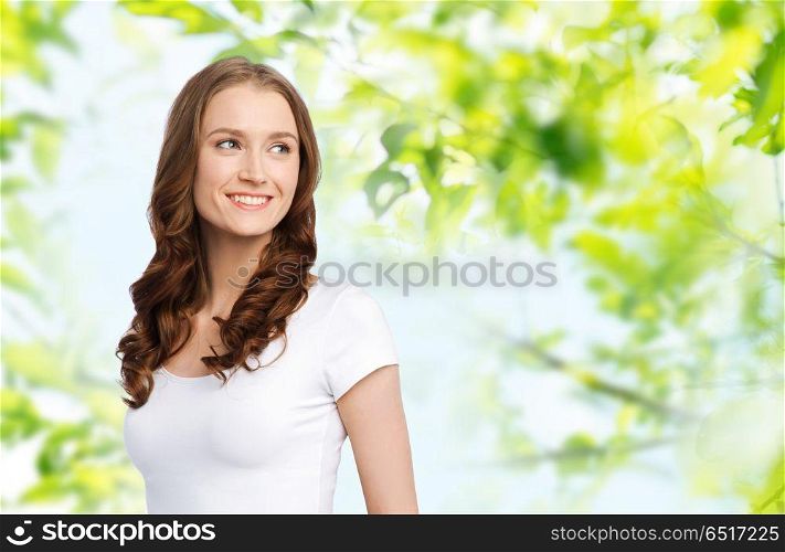 body positive and people concept - happy woman in white t-shirt over green natural background. happy woman in white t-shirt. happy woman in white t-shirt