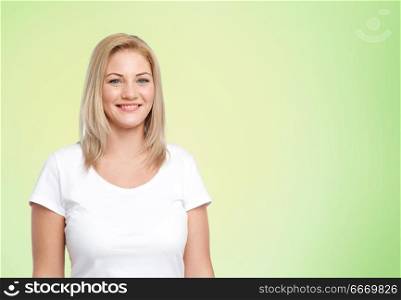 body positive and people concept - happy woman in white t-shirt over lime green background. happy woman in white t-shirt over lime green. happy woman in white t-shirt over lime green