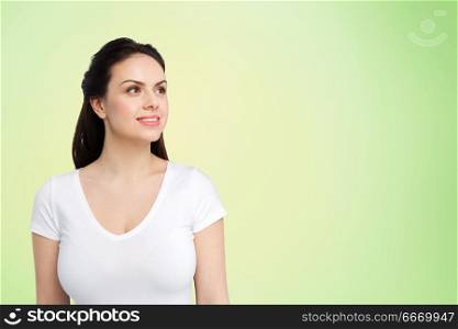 body positive and people concept - happy woman in white t-shirt over lime green background. happy woman in white t-shirt over lime green. happy woman in white t-shirt over lime green